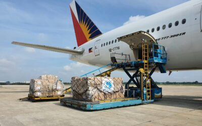 Cargo being loaded onto a commercial airplane at an airport in Ho Chi Minh City, Vietnam.